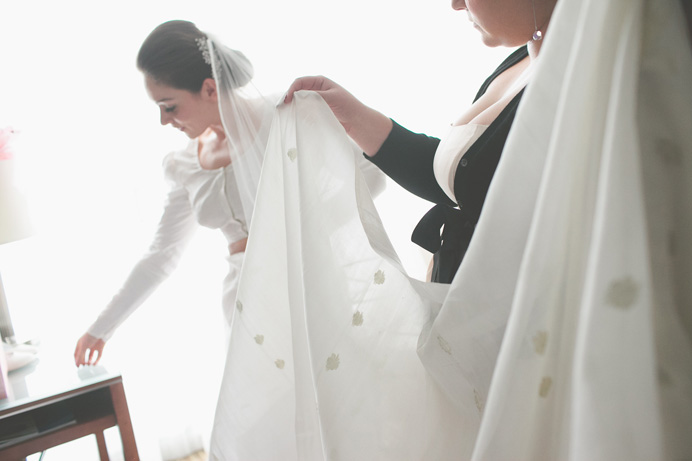 Bride putting on a sari before the wedding Tea House in Stanley Park Wedding on New Years Day | Linnie + Nico