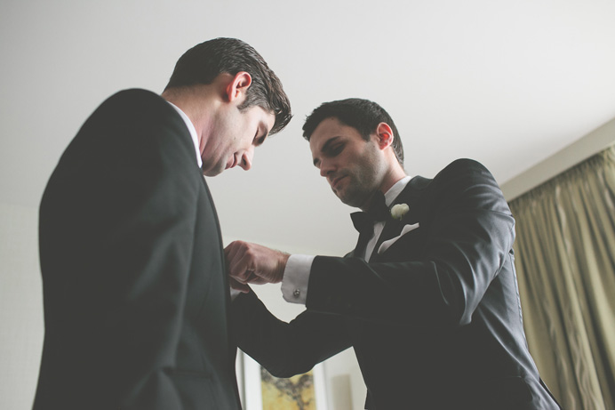 Groom getting ready at the Westin Bayshore Hotel Tea House in Stanley Park Wedding on New Years Day | Linnie + Nico