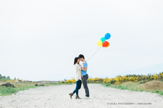 couple holding balloons
